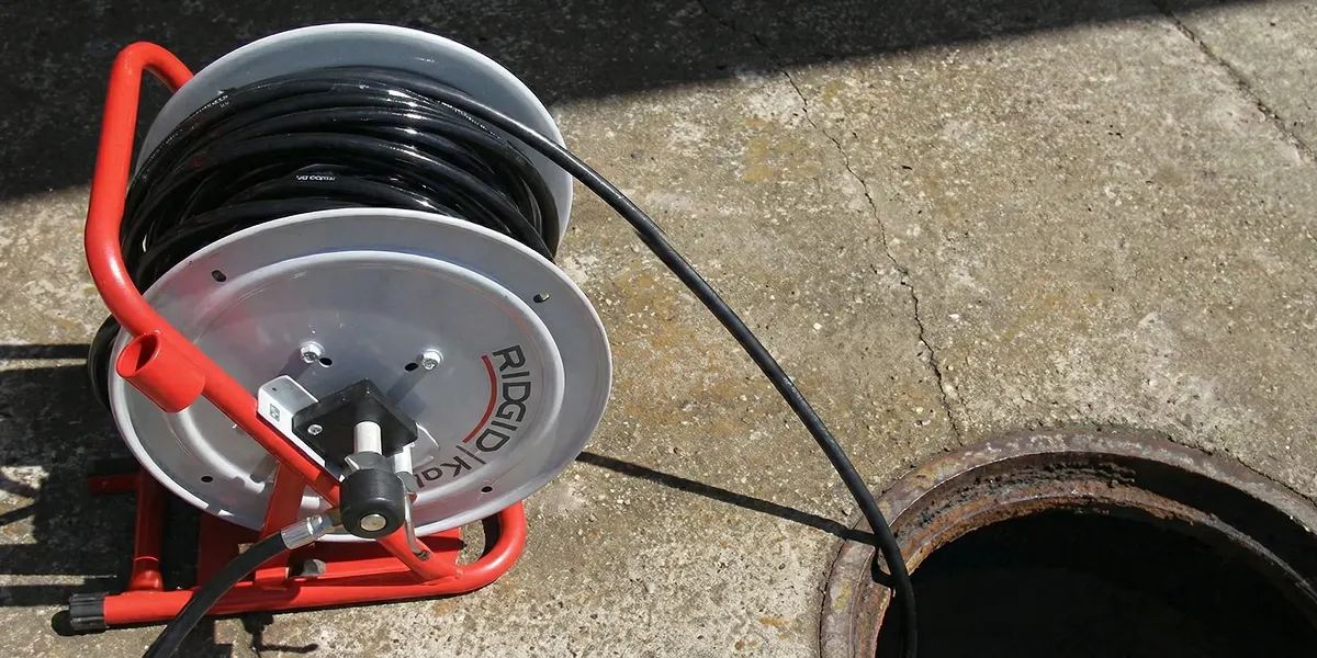 sewer rodding equipment prepared to clear clogged sewer lines in Columbia, MO